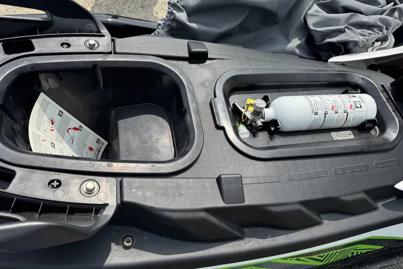 Slide: The Image of 2020 Yamaha WaveRunner EX Deluxe storage compartment with fire extinguisher and manual. - 8