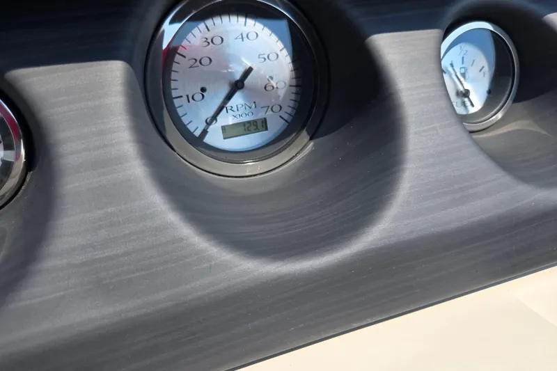 Slide: The Image of Dashboard gauges of 2019 Bennington SX 22 Premium Cruise boat. - 22