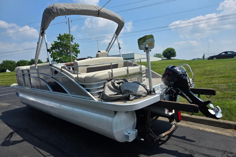 Slide: The Image of 2019 Bennington SX 22 Premium Cruise pontoon boat with canopy and outboard motor. - 3