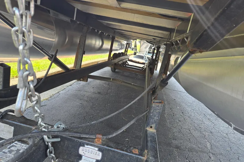 Slide: The Image of Underneath view of a 2019 Bennington SX 22 Premium Cruise on a trailer. - 7
