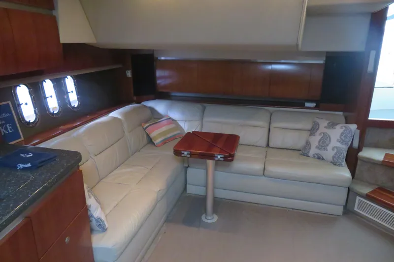Slide: The Image of Luxurious 2007 Cruisers Yachts 420 Express interior with plush seating and elegant wood finishes. - 10