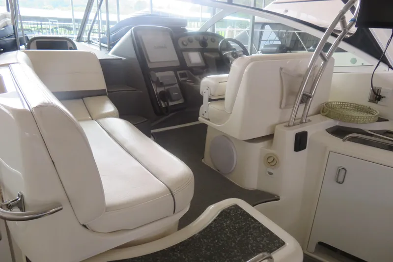 Slide: The Image of 2007 Cruisers Yachts 420 Express interior with helm, seating, and modern amenities. - 14