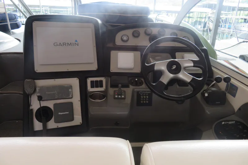 Slide: The Image of 2007 Cruisers Yachts 420 Express helm with Garmin navigation and steering wheel. - 15