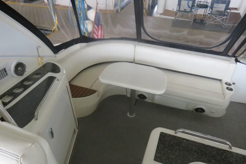 Slide: The Image of 2007 Cruisers Yachts 420 Express interior with seating and table setup. - 17