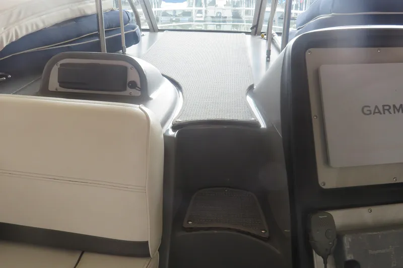 Slide: The Image of 2007 Cruisers Yachts 420 Express interior with Garmin navigation system and seating area. - 18