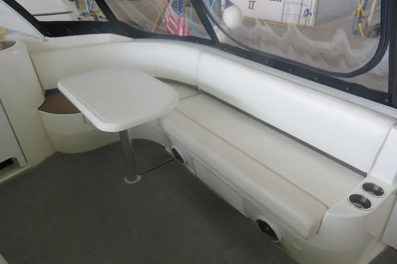 Slide: The Image of 2007 Cruisers Yachts 420 Express interior with white seating and table. - 19