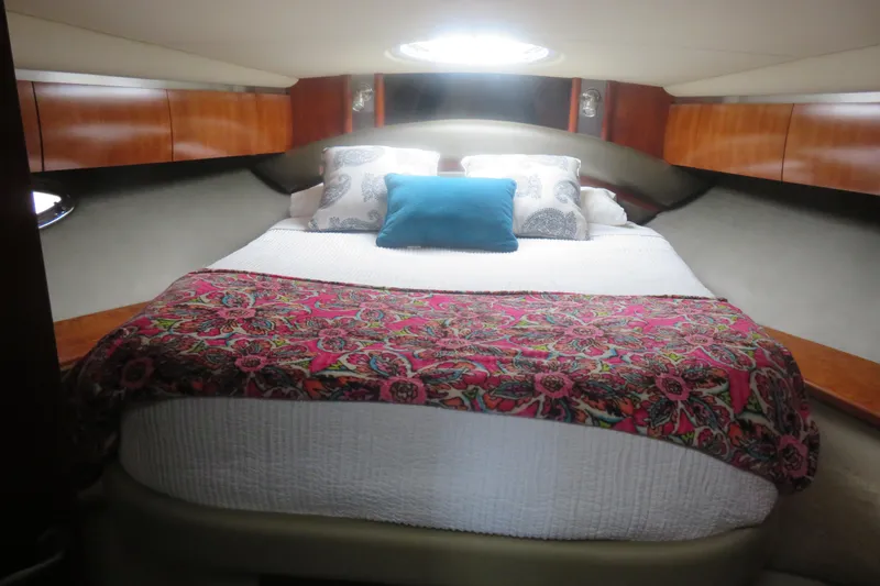 Slide: The Image of Luxurious cabin interior of 2007 Cruisers Yachts 420 Express with vibrant bedding. - 4