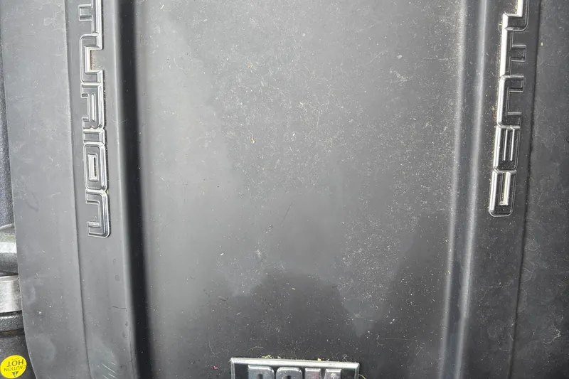 Slide: The Image of Close-up of 2021 Centurion Ri265 boat engine cover with logo. - 13