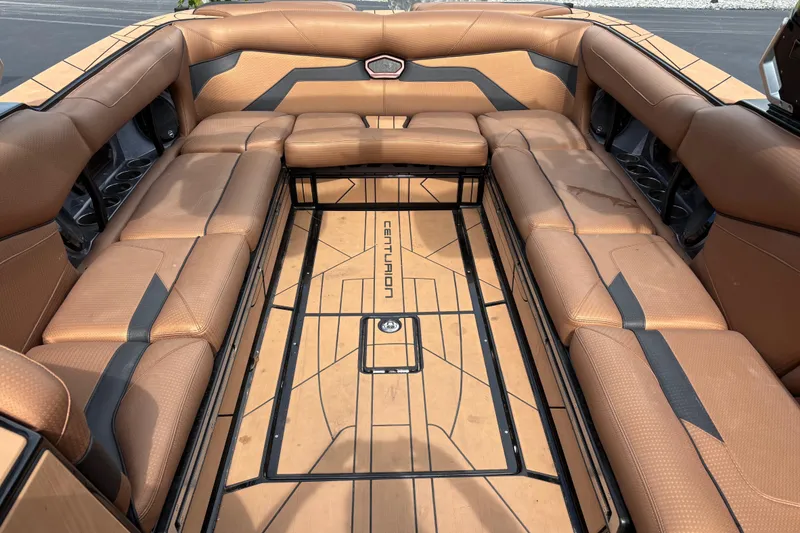 Slide: The Image of 2021 Centurion Ri265 boat interior with tan leather seating and custom flooring. - 6