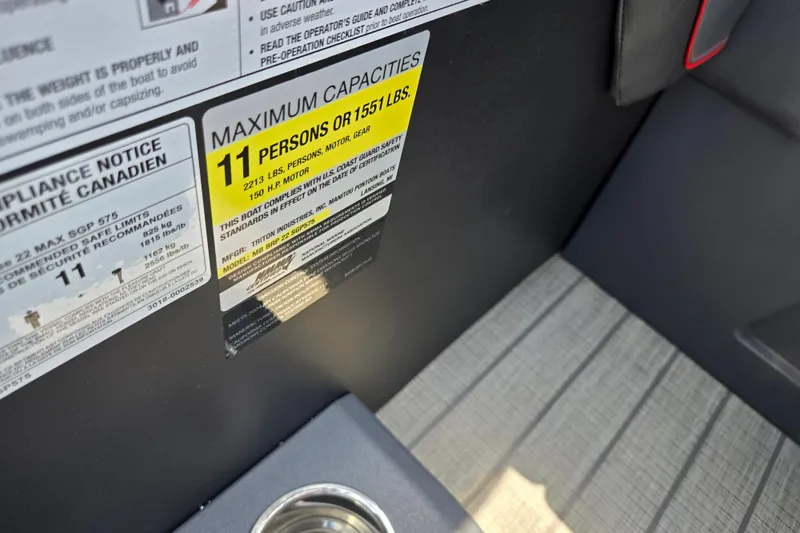 Slide: The Image of 2024 Manitou Explore capacity label, maximum 11 persons or 1551 lbs, safety compliance details. - 13