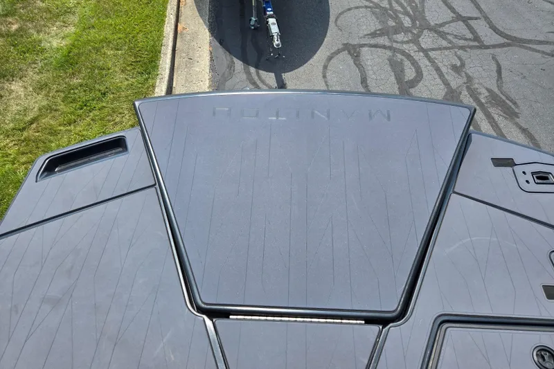 Slide: The Image of 2024 Manitou Explore boat deck, featuring sleek design and modern detailing. - 16