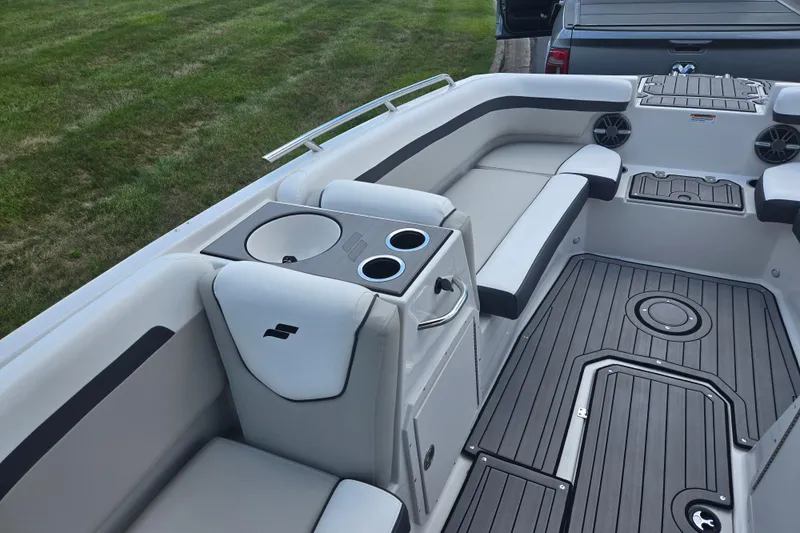 Slide: The Image of 2024 Starcraft SVX 191 OB boat interior with seating and cup holders. - 12