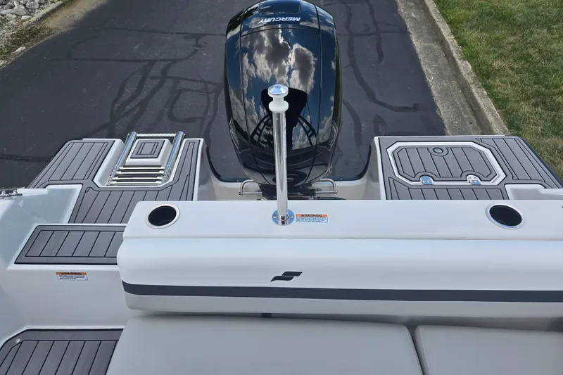 Slide: The Image of 2024 Starcraft SVX 191 OB boat with Mercury engine, featuring sleek deck design. - 21