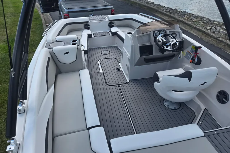 Slide: The Image of 2024 Starcraft SVX 191 OB boat interior with modern seating and steering console. - 9