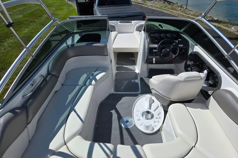 Slide: The Image of 2011 Yamaha Boats AR210 interior with seating, steering wheel, and dashboard. - 10