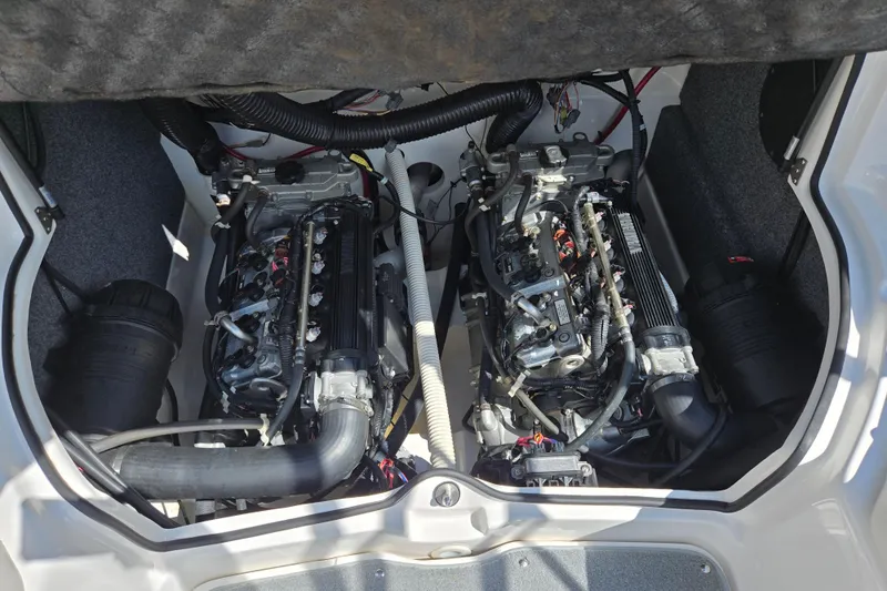 Slide: The Image of 2011 Yamaha Boats AR210 engine compartment with dual engines and wiring. - 24