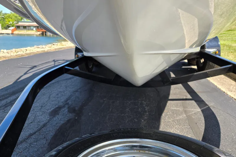 Slide: The Image of 2011 Yamaha AR210 boat on trailer, near a lake, sunny day. - 7