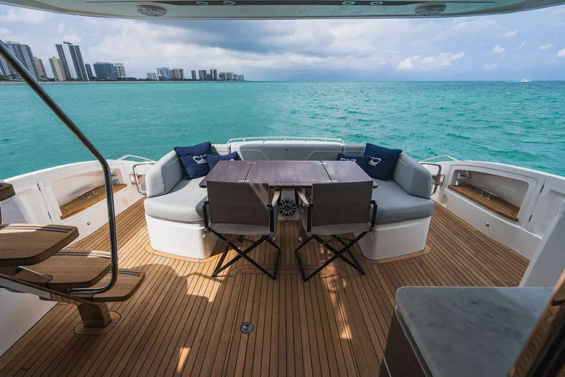 Slide: The Image of Luxury 2022 Princess S66 yacht deck with ocean view and seating area. - 23