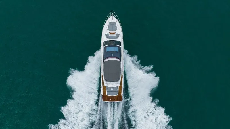 Slide: The Image of Aerial view of 2022 Princess S66 yacht cruising on open water. - 4