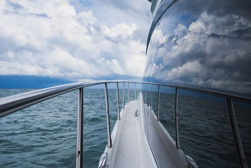 Slide: The Image of Luxury yacht Princess S66 on open sea with cloudy sky reflection. - 42