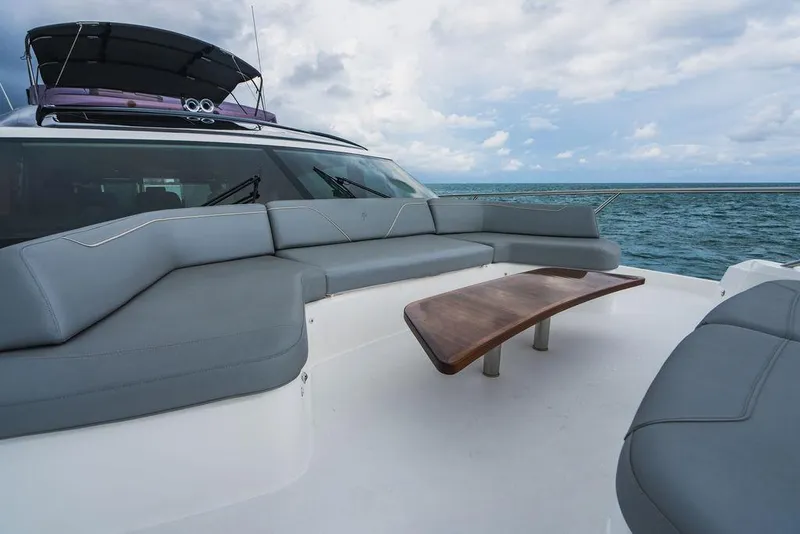 Slide: The Image of Luxury Princess S66 yacht deck with gray seating and wooden table, 2022 model, ocean view. - 46