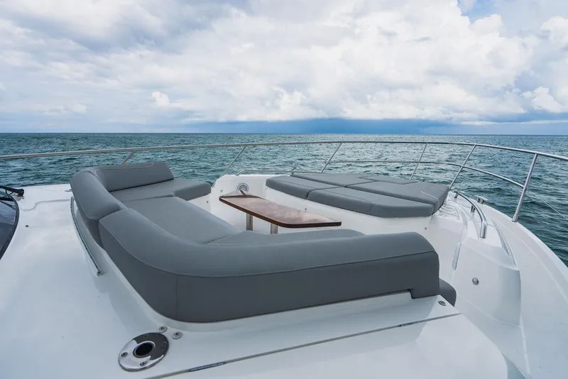 Slide: The Image of Luxurious 2022 Princess S66 yacht deck with gray seating and ocean view. - 47