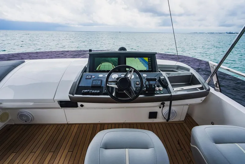 Slide: The Image of Helm of 2022 Princess S66 yacht with ocean view and modern controls. - 49
