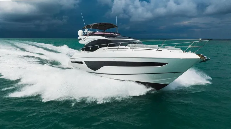 Slide: The Image of 2022 Princess S66 yacht cruising on turquoise ocean under cloudy sky. - 9