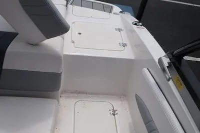 Slide: The Image of 2020 Chaparral 21 Surf boat interior with seating and storage compartments. - 10