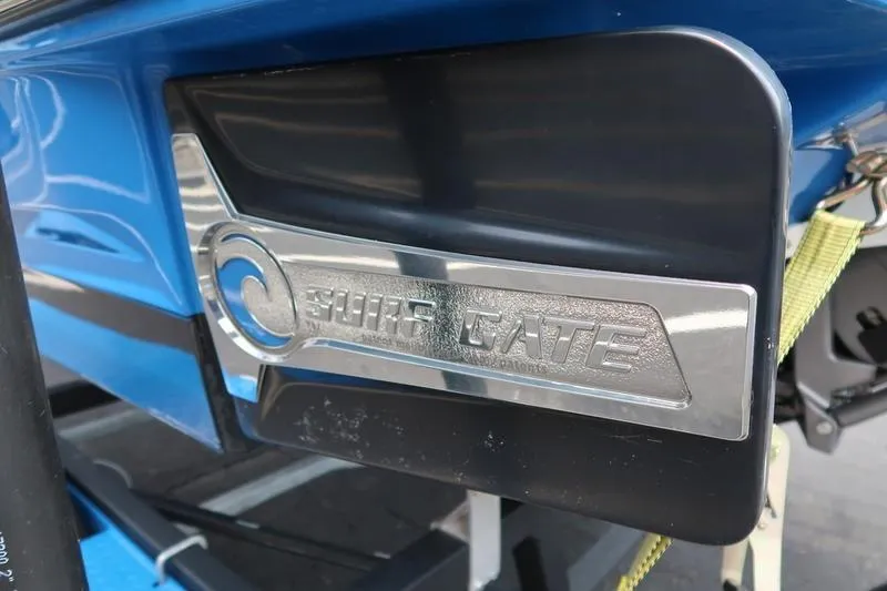 Slide: The Image of 2020 Chaparral 21 Surf boat with Surf Gate feature, close-up view. - 12