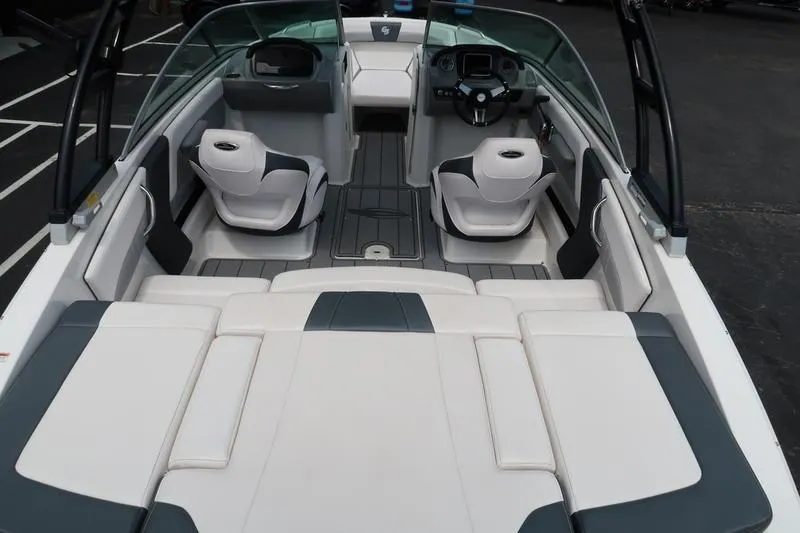 Slide: The Image of 2020 Chaparral 21 Surf boat interior with sleek seating and modern dashboard design. - 13