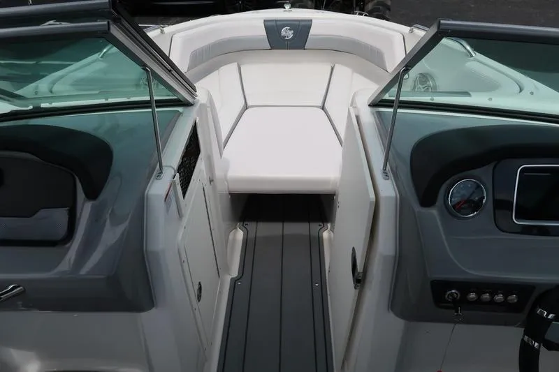 Slide: The Image of 2020 Chaparral 21 Surf boat interior with seating and dashboard view. - 14