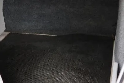 Slide: The Image of Interior view of 2020 Chaparral 21 Surf boat, featuring dark textured flooring. - 20