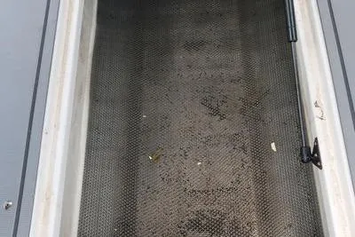 Slide: The Image of Storage compartment of 2020 Chaparral 21 Surf boat, featuring textured flooring. - 22