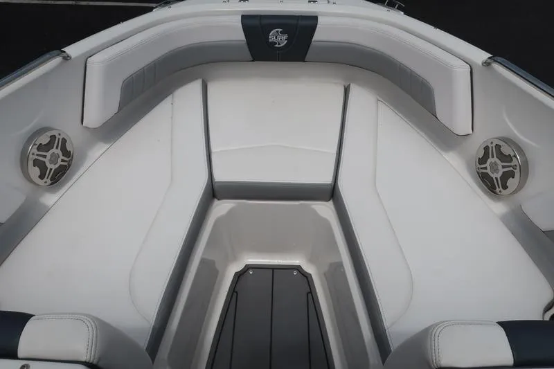 Slide: The Image of 2020 Chaparral 21 Surf boat interior with cushioned seating and speakers. - 24
