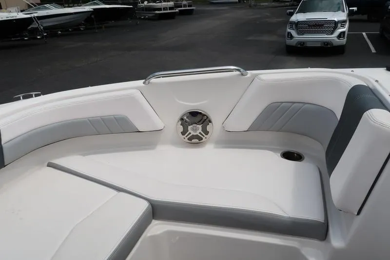 Slide: The Image of Interior of 2020 Chaparral 21 Surf boat with white seating and speaker. - 25