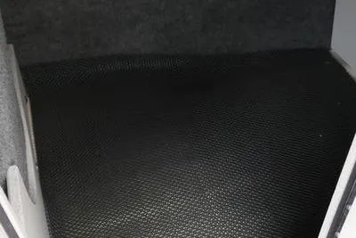 Slide: The Image of Interior view of 2020 Chaparral 21 Surf boat with textured flooring. - 26