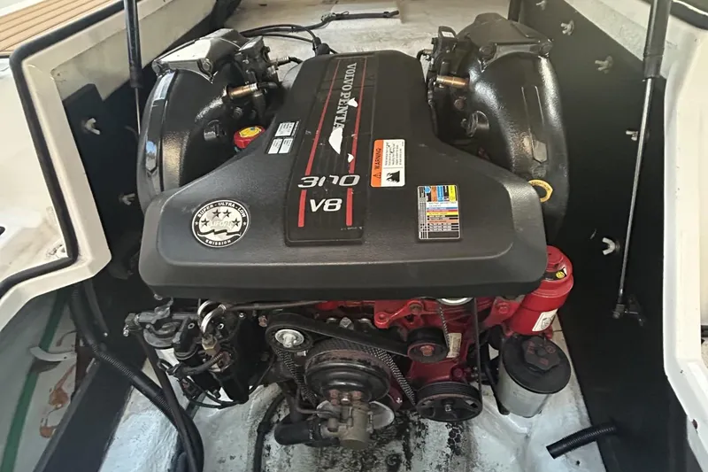 Slide: The Image of Engine of a 2015 Regal 27 FasDeck boat, featuring a Volvo Penta 310 V8. - 10