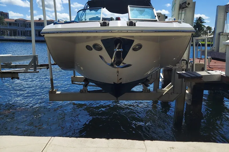 Slide: The Image of 2015 Regal 27 FasDeck boat on lift by waterfront dock. - 16
