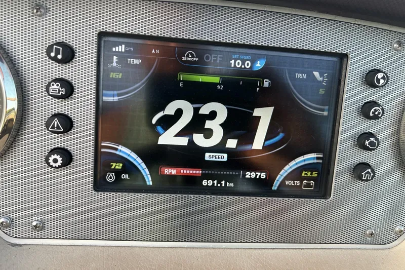 Slide: The Image of Dashboard of a 2015 Regal 27 FasDeck showing speed, RPM, and other metrics. - 2