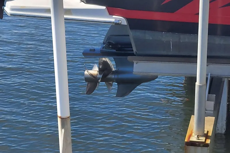 Slide: The Image of 2015 Regal 27 FasDeck boat propeller above water at dock. - 26