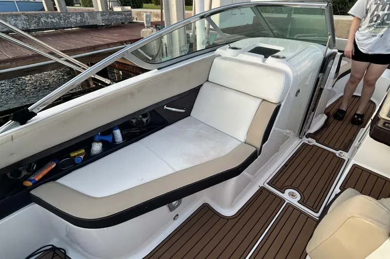 Slide: The Image of 2015 Regal 27 FasDeck boat interior with seating and storage compartments. - 7
