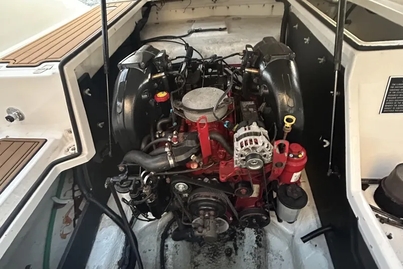 Slide: The Image of Engine compartment of a 2015 Regal 27 FasDeck boat, showcasing detailed engine components. - 9