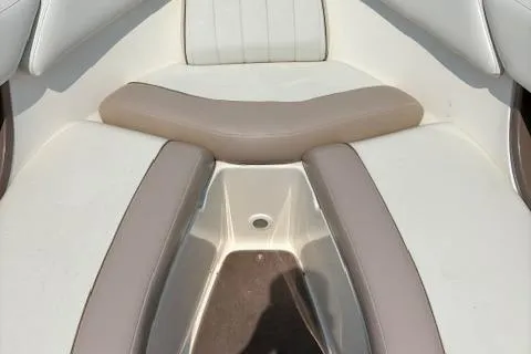 Slide: The Image of 2003 Regal 2200 Bowrider boat interior with beige and white seating. - 13