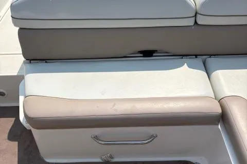 Slide: The Image of 2003 Regal 2200 Bowrider boat seat with beige and white upholstery. - 8