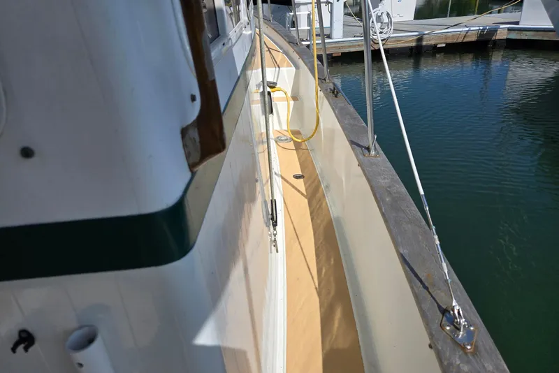 Slide: The Image of 1973 Willard Marine Vega Nomad Flybridge boat deck at marina. - 11