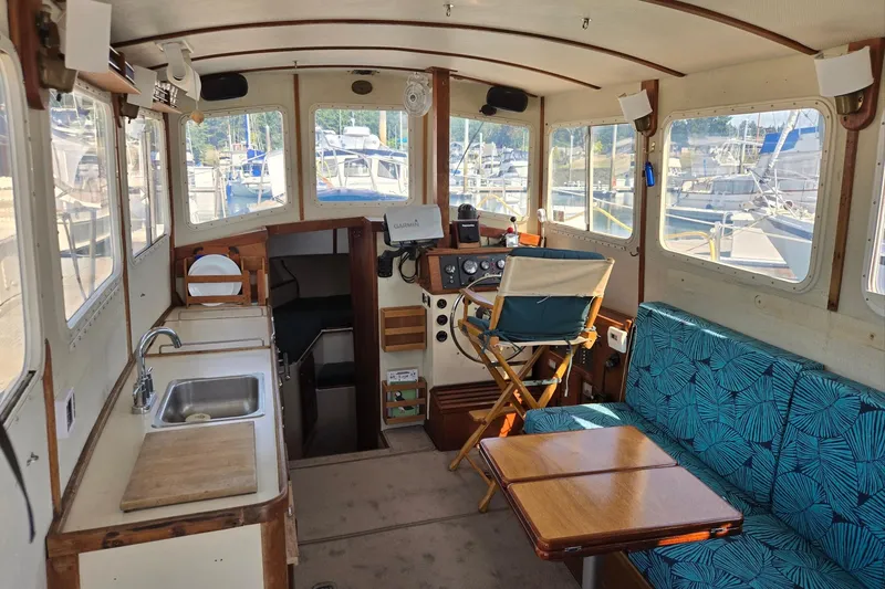 Slide: The Image of Interior of a 1973 Willard Marine Vega Nomad Flybridge boat with seating and helm. - 20