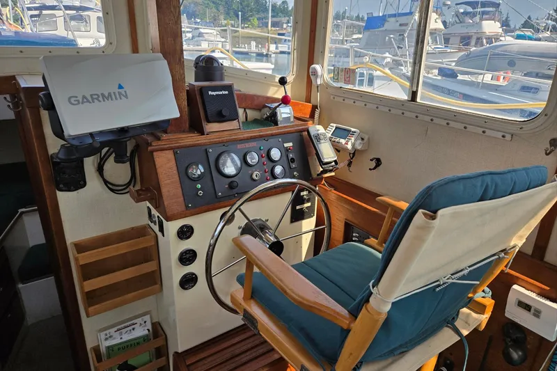 Slide: The Image of 1973 Willard Marine Vega Nomad Flybridge helm with Garmin navigation system and classic controls. - 22