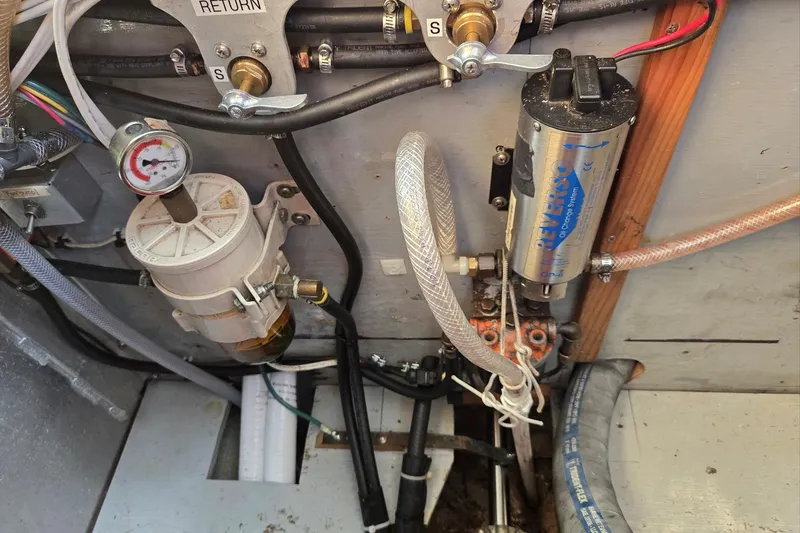 Slide: The Image of Engine compartment of a 1973 Willard Marine Vega Nomad Flybridge with fuel system components. - 34