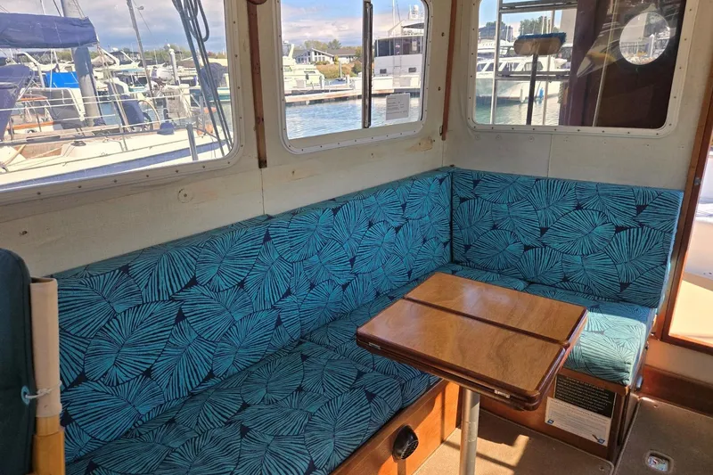 Slide: The Image of Interior of 1973 Willard Marine Vega Nomad Flybridge with blue patterned seating. - 36